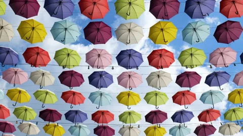 Multicolored umbrellas hanging high Stockbeeldmateriaal 172299659