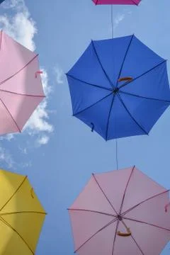 Multicolored umbrellas in the sky Stock Photos
