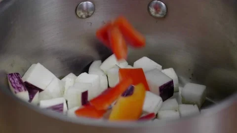 Multicolored Vegetables Dropped into Pot Stock Footage 166863447