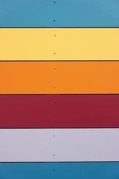 Multicolored wall cladding background with horizontal panels Stock Photos