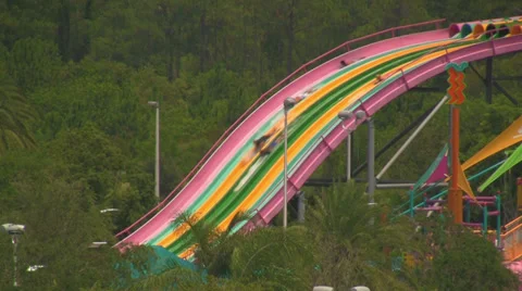 Multicolored Water Speed Slides in Distance Video stock 30493064