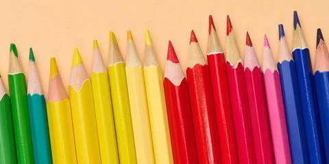 Multicolored wooden pencils in a row, drawing and creativity tools Fotos Stock