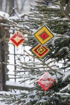 Multicolored wool Christmas tree decorations hanging on the a Christmas tree Stock Photos