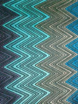 Multicolored zigzags on fabric Stock Photos