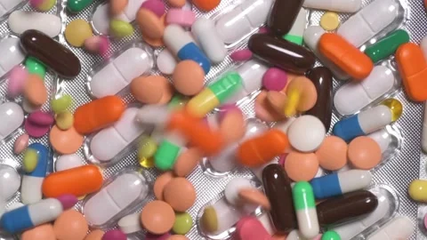 Multicolour pills spinning Video stock 168639365