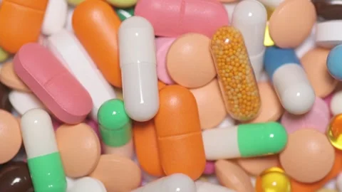 Multicolour pills spinning Video stock 168641900