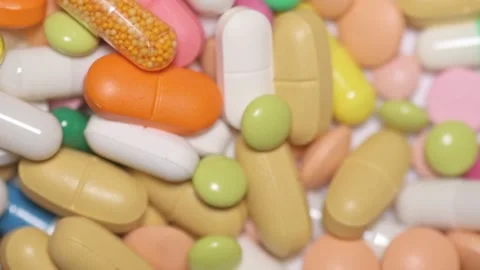 Multicolour pills spinning Video stock 168642035
