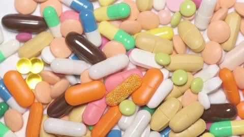 Multicolour pills spinning Video stock 168642131
