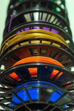 Multicoloured filament of plastic for 3D printer close up with selective focus Stock Photos