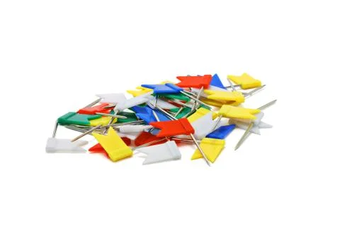 Multicoloured flag shape push pins Stock Photos