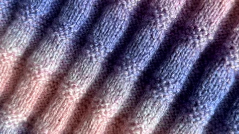 Multicoloured handmade knitted woolen fabric background. Stock Footage 340614191