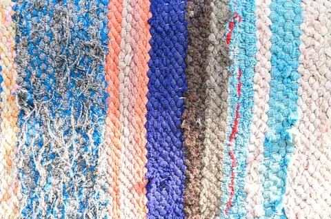 Multicoloured homespun texture carpet Stock Photos