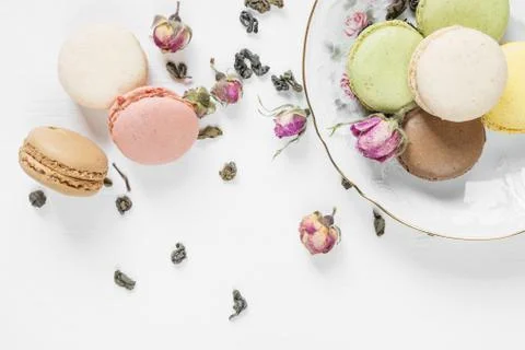 Multicoloured macaroons and tea Stock Photos