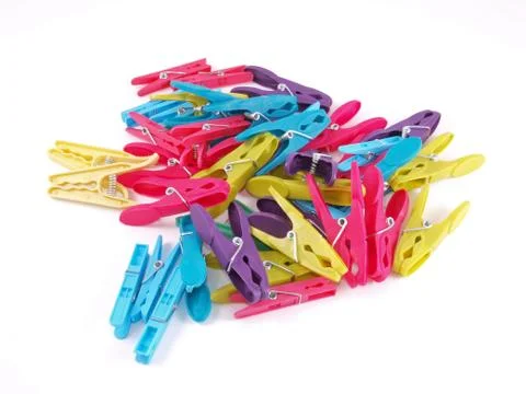 Multicoloured plastic clothes pegs. Stock Photos