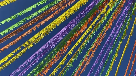 Multicoloured ribbons decorating the street in front of the blue sky. Stock Footage 196244689