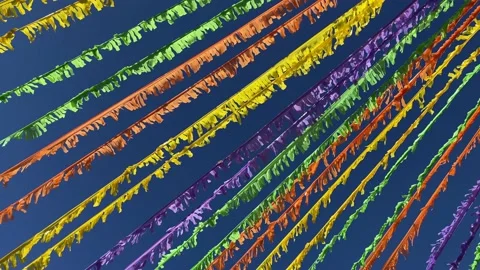 Multicoloured ribbons decorating the street in front of the blue sky. 4K Stock Footage 199395525