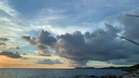 Multicoloured sunset over the sea. View from the seashore. Stock Footage 190940216