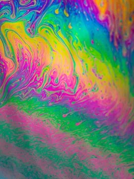 Multicolours as light refracts through liquid soap Photos