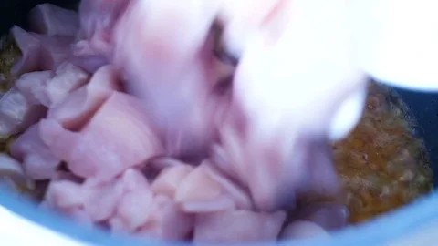 Multicooker. adding pieces chicken, carrot, onion, butter. Stock Footage 77214768