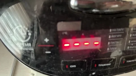 Multicooker switching modes on digital display close up at home, changing Stock Footage 337104831