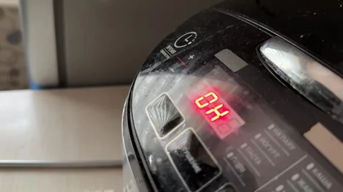 Multicooker switching modes on digital display close up at home, changing Stock Footage 337104833
