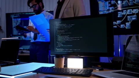 Multicultural business and engineering team discussing software Stock Footage 340462871