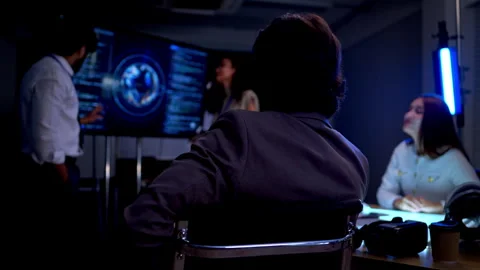 Multicultural business and engineering team discussing software Stock Footage 340563699