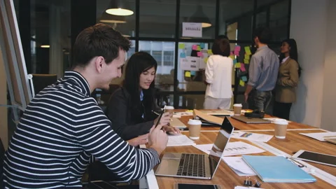 Multicultural business people planning working together at meeting using laptop Video stock 171057077