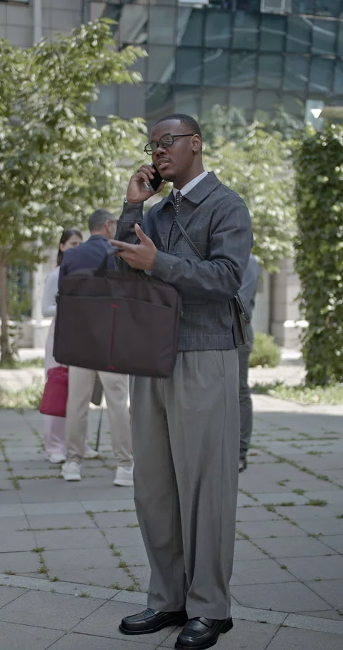 Multicultural Business Professionals Communicating and Working Outdoors in a Stock Footage 314857283