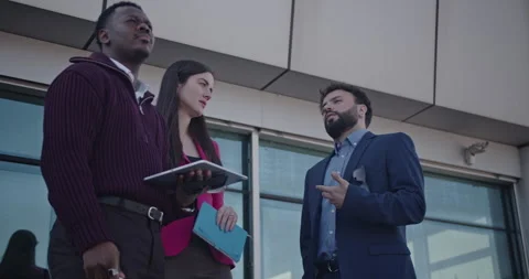 Multicultural Business Team Collaborates on a Terrace During a Morning Meeting Stock Footage 314138837