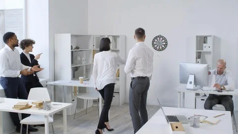 Multicultural Colleagues Playing Darts in Pairs Stock Footage 108664388