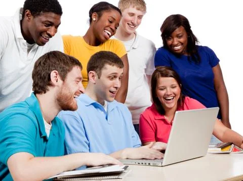 Multicultural college students around a computer Stock Photos