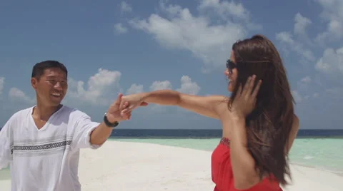 Multicultural Couple In Love Dances Happily On White Sandy Patch Island Stock Footage 45857122