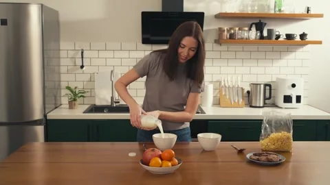 Multicultural couple preparing breakfast together in the kitchen. Video stock 305049026