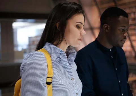 Multicultural couple in a public library Stock Photos