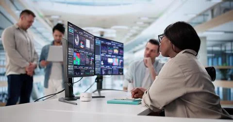 Multicultural Data Analyst Using Predictive Analytics For Business Performanc Stock Photos