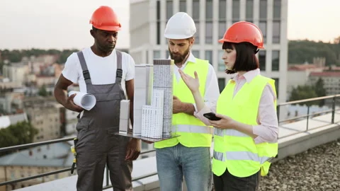 Multicultural designers with equipment posing on rooftop Stock Footage 258388768