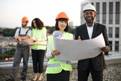 Multicultural developers controlling building quality 写真素材