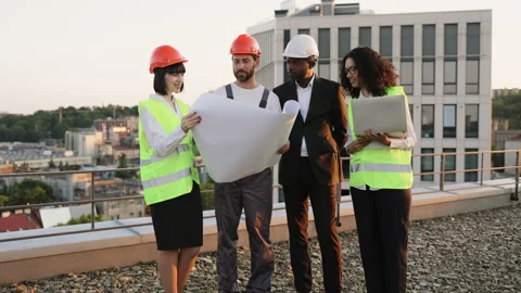 Multicultural developers smiling at camera on terrace Stock Footage 246125961