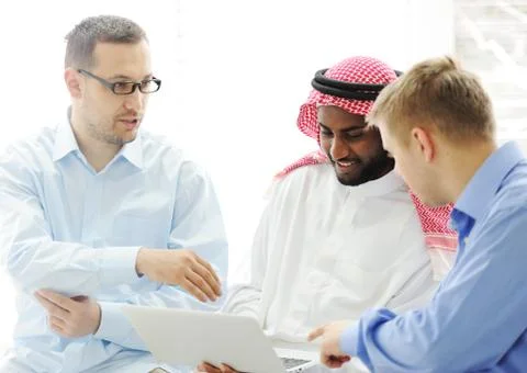Multicultural different ethnic group working on laptop together Stock Photos
