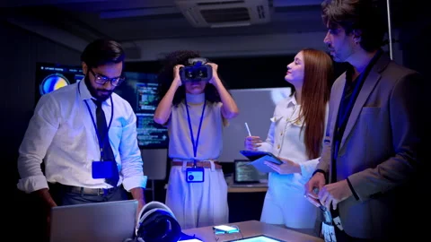 Multicultural engineering and business team discussing virtual reality Stock Footage 340563802