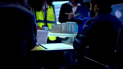 Multicultural engineering team presenting architectural plans Stock Footage 340454796