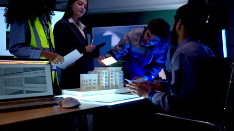 Multicultural engineering team presenting architectural plans Stock Footage 340455134