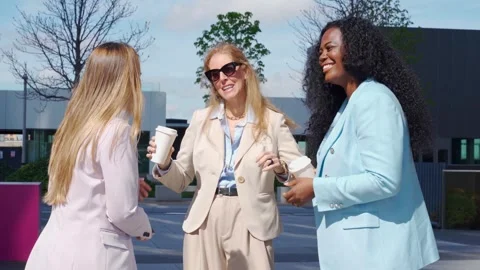 Multicultural Executives Enjoying Coffee Break in the Street Stock Footage 243193989
