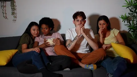 Multicultural Friends Experiencing Shock During a Movie Night at Home Stock Footage 264029897