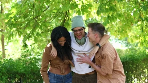 Multicultural friends laughing and having fun in a park Stock Footage 314337829