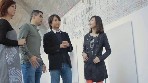 Multicultural Friends Visiting an Art Gallery in Beijing China while Talking Stock Footage 107110942
