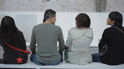 Multicultural Friends Visiting an Art Gallery in Beijing China while Talking Stock Footage 107111111