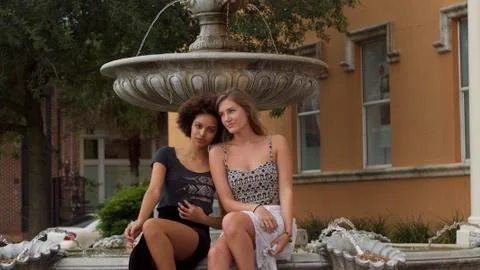 Multicultural Girlfriends Sitting Stock Photos