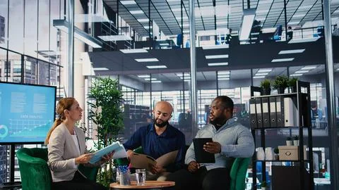Multicultural group of CEOs welcoming each other in a negotiations meeting Stock Photos
